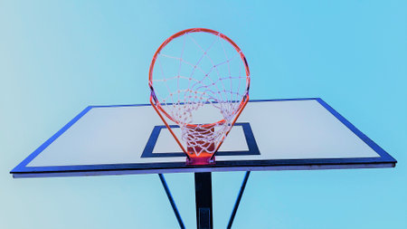 basketball hoop on blue sky background, bottom view.