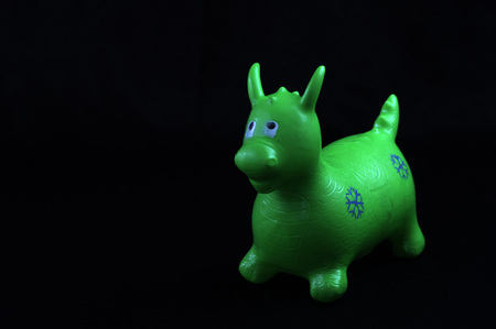 on black background, composed of vivid colors, for children, plastic, toy animal
