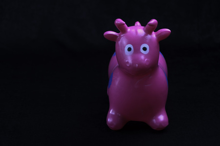 on black background, composed of vivid colors, for children, plastic, toy animalの写真素材