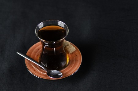a cup of tea lit by artificial light