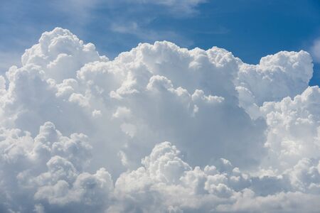 vivid immense white cloud with blue sky backgroundの写真素材