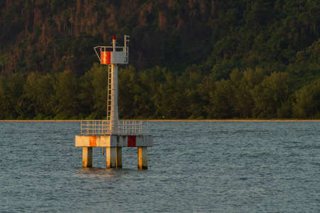 The lighthouse navigate for maritime pilots in the sea.の写真素材