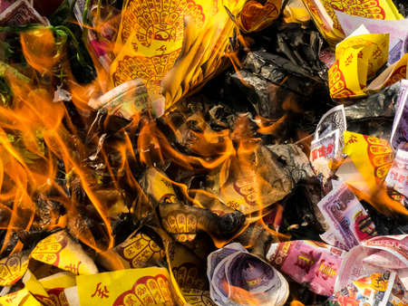 burning silver-gold paper , is believe of chineseの写真素材