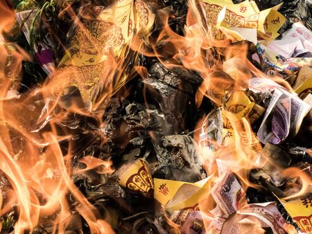 burning silver-gold paper , is believe of chineseの写真素材