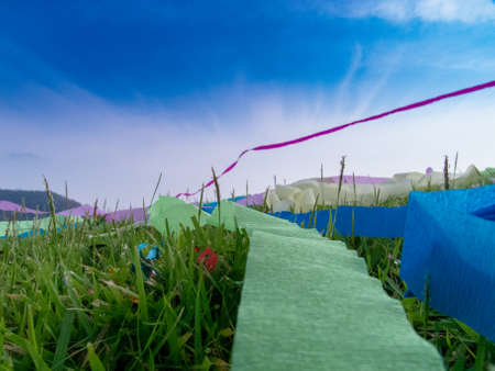 girl play ribbon on hill with landscapeの写真素材