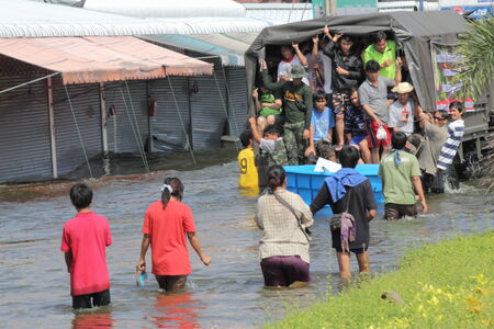 THAILAND Flood Bang Bua Thong City 20 10  2011 Moving their belongings to flee floods Pathum Thani Samkhok Rd   THAILAND のeditorial素材