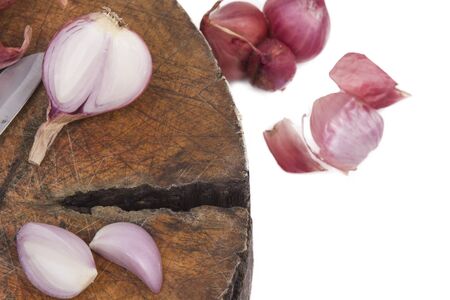 The sliced onion on a wooden cutting board.の写真素材