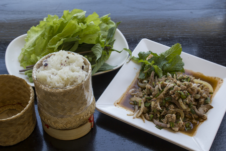 Isan Food ,Northeast of Thailand.Laab The pork served with sticky rice.の写真素材