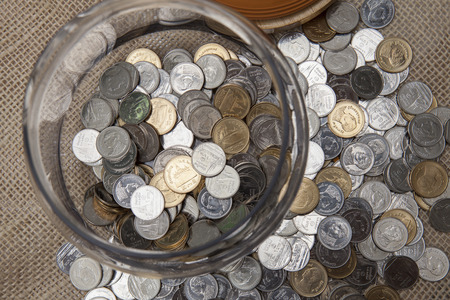 Coins stored in glass bottles.の写真素材