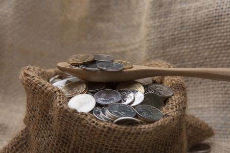 Coins stored in glass bottles.の写真素材