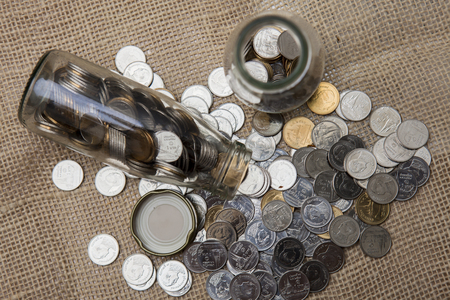 Coins stored in glass bottles.の写真素材