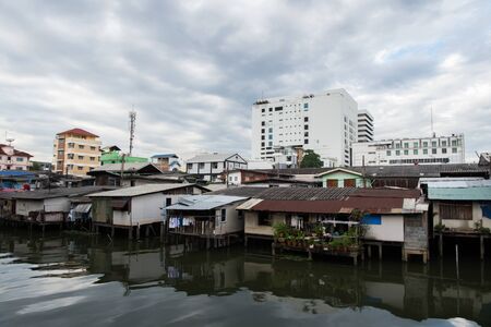 Wooden house beside the water following the Thai culture in Bangkokの写真素材