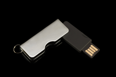 Flash drive on black background. Top view