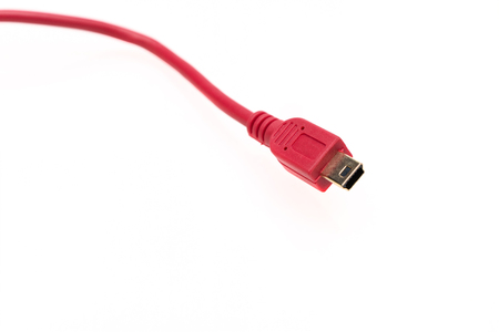Red usb-cable micro usb. On white isolated backgroundの写真素材