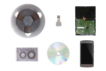 USB Flash Drive Shaped Key, Mobile Phone, CD / DVD, Tape, Hard Drive, Analog Tape. Isolated white backgroundの写真素材