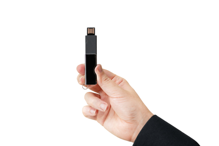 USB Flash drive on hand. Isolated white background