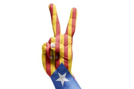 Catalan flag painted on hand celebrating victory. Referendum. Isolated white backgroundの写真素材