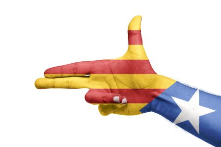 Catalan flag painted in the hand with pistol shape. Referendum. Isolated white backgroundの写真素材