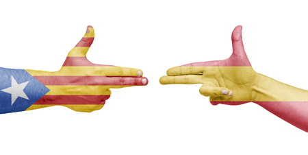 Flags of the Catalonia and Spain in the form of handguns. Isolated white backgroundの写真素材