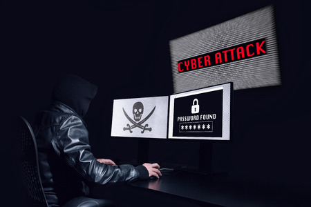 Anonymous hacking with a cyber attack and getting the password of the victim. Black backgroundの写真素材