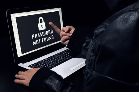 Failed hacking on a laptop. Insulting with your fingerの写真素材