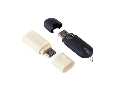 Wooden and black USB flash memory isolated on white. Two pen driveの写真素材