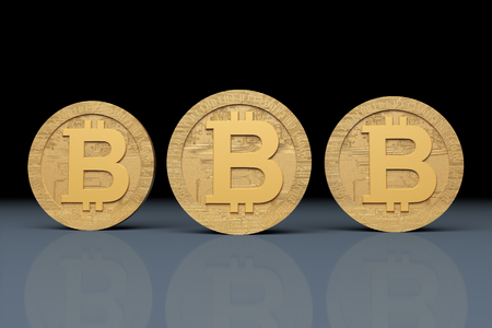 Three Gold Bitcoin coins on blue and black background. Front viewの写真素材