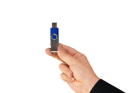 Blue flash drive on hand with isolated white background. Front viewの写真素材
