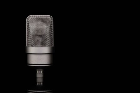 Mic - Close-up of professional condenser microphone on a black isolated background. Large-diaphragm microphoneの写真素材