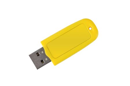 USB memory stick - Yellow flash drive on white insulated background. Close-upの写真素材