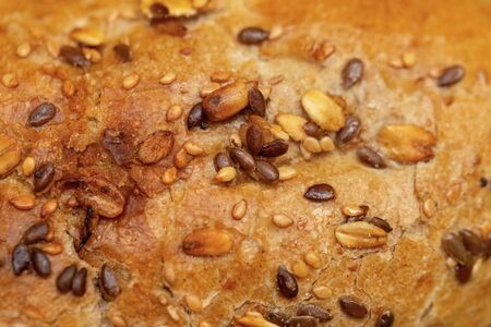 Detail of a bread with cereals and nuts. Macro view - close-upの写真素材