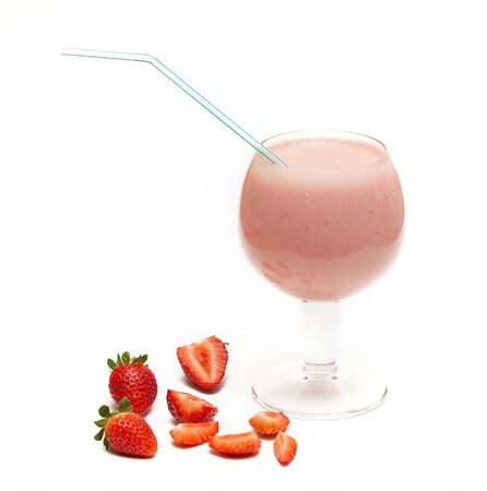 Fresh strawberry juice on a white background. Strawberries decorating the bottomの写真素材
