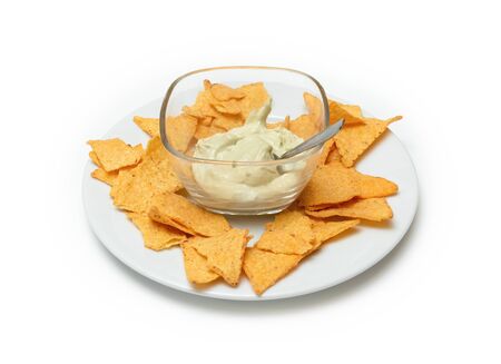 Nachos with guacamole on a plate. Isolated white backgroundの写真素材