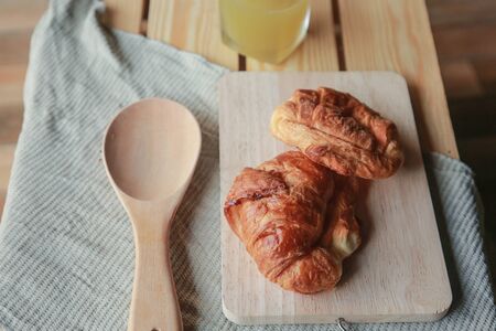Tasty croissants  on wooden backgroundの写真素材