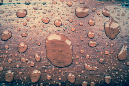 water droplets on wood with textureの写真素材
