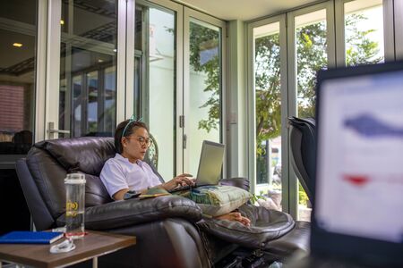 Asian woman working at home