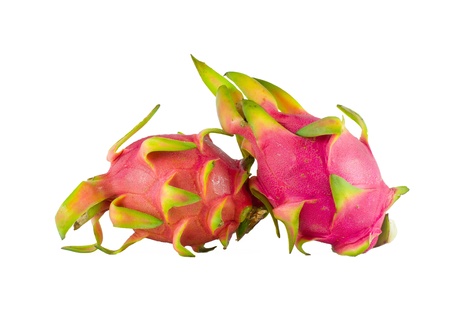 A BRIGHTLY COLORED DRAGON FRUIT AGAINST WHITE BACKGROUNDの写真素材