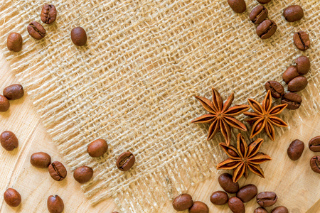 coffee beans, and star anise on wooden table. Space for textの写真素材