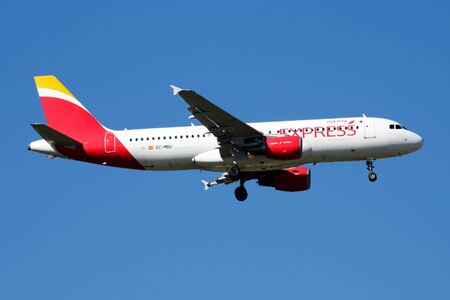 MADRID / SPAIN - MAY 2, 2016: Iberia Express Airbus A320 EC-MBU passenger plane landing at Madrid Barajas Airportのeditorial素材