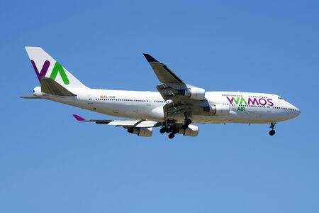 MADRID / SPAIN - MAY 2, 2016: Wamos Air Boeing 747-400 EC-KSM passenger plane landing at Madrid Barajas Airportのeditorial素材