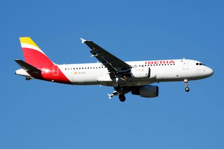 MADRID / SPAIN - MAY 2, 2016: Iberia Airlines Airbus A320 EC-ILS passenger plane landing at Madrid Barajas Airportのeditorial素材