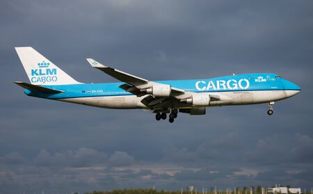 AMSTERDAM / NETHERLANDS - AUGUST 16, 2014: KLM Cargo Boeing 747-400 PH-CKA cargo plane landing at Amsterdam Schipol Airportのeditorial素材