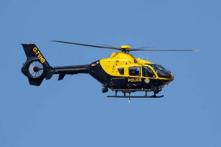 LONDON / UNITED KINGDOM - JULY 14, 2018: Metropolitan Police Eurocopter EC-135 helicopter flying at London Heathrow Airportのeditorial素材