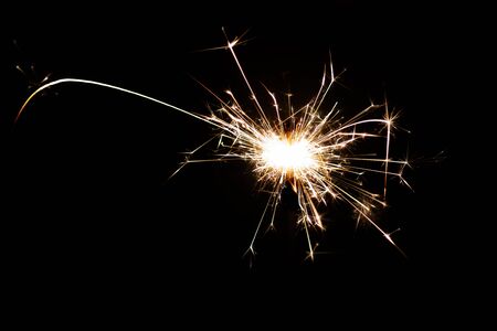 Isolated burning sparkler, fireworks for holidays includes christmas, happy new yearの写真素材