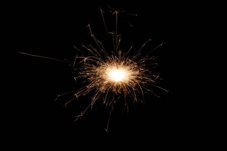 Isolated burning sparkler, fireworks for holidays includes christmas, happy new yearの写真素材