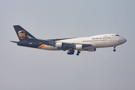 Hong Kong / China - November 16, 2013: UPS Airlines Boeing 747-400 N574UP cargo plane arrival and landing at Hong Kong Chek Lap Kok Airportのeditorial素材