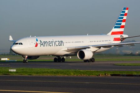 Paris / France - April 24, 2015: American Airlines Airbus A330-300 N276AY passenger plane arrival and landing at Paris Charles de Gaulle Airportのeditorial素材