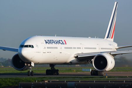 Paris / France - April 24, 2015: Air France Boeing 777-300ER F-GSQM passenger plane arrival and landing at Paris Charles de Gaulle Airportのeditorial素材