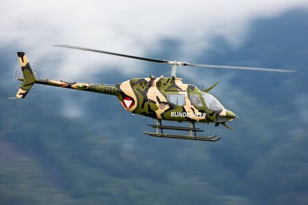 Zeltweg / Austria - September 6, 2019: Austrian Air Force Bell OH-58 Kiowa 3C-OH flying at Zeltweg Air Baseのeditorial素材