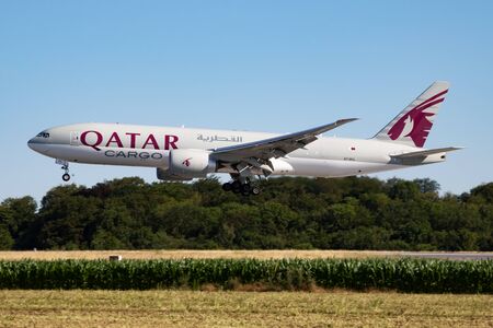 Findel - Luxembourg / July 8, 2018: Qatar Airways Cargo Boeing 777-200 A7-BFL cargo plane arrival and landing at Luxembourg Findel airportのeditorial素材